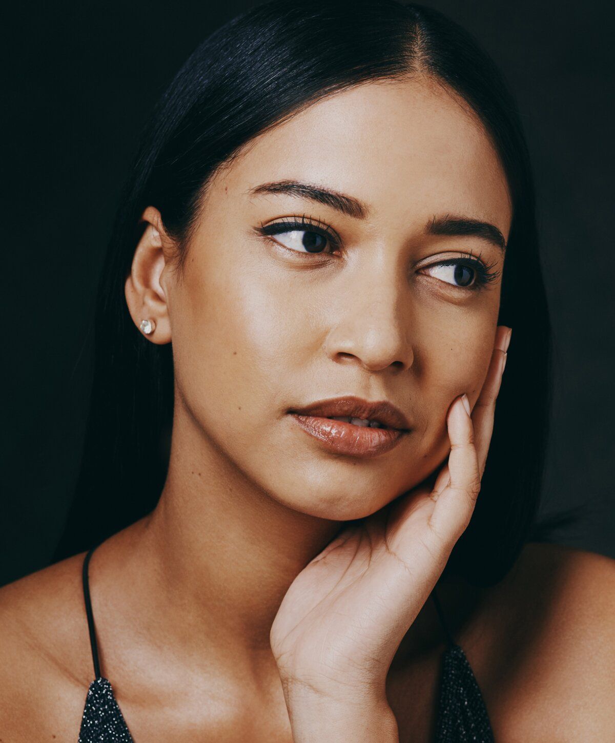Close-up of a woman with long black hair.