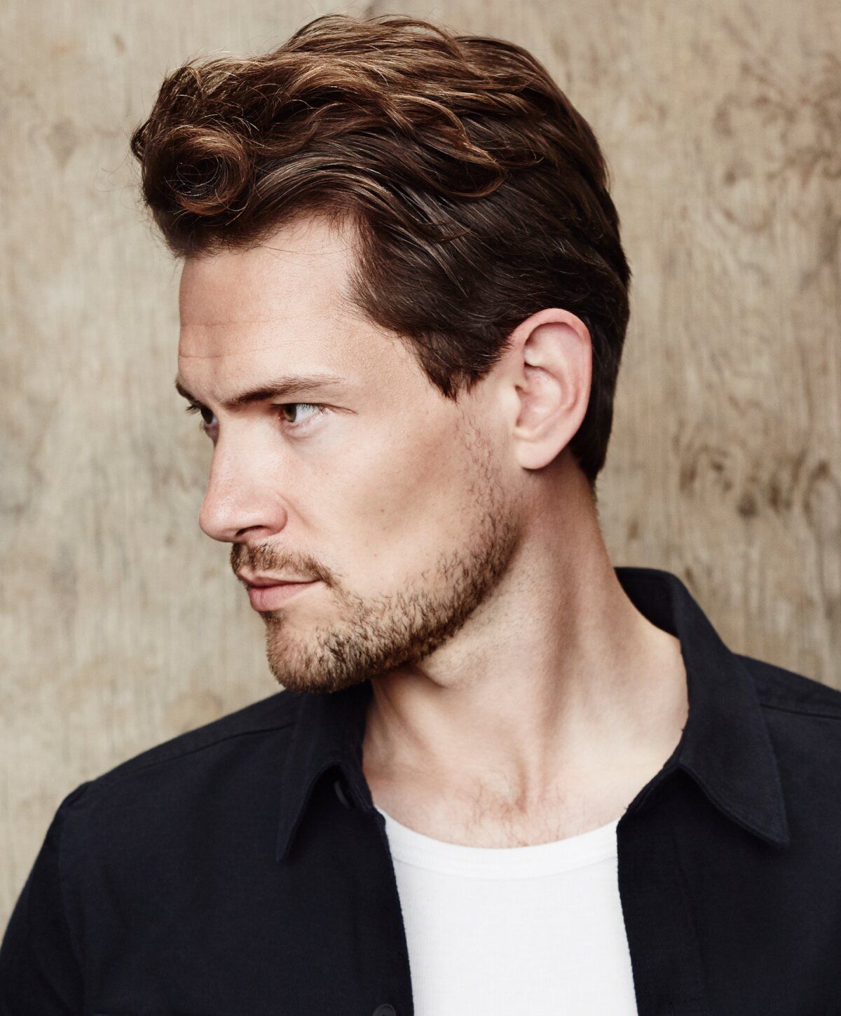 Profile of a man with styled hair.