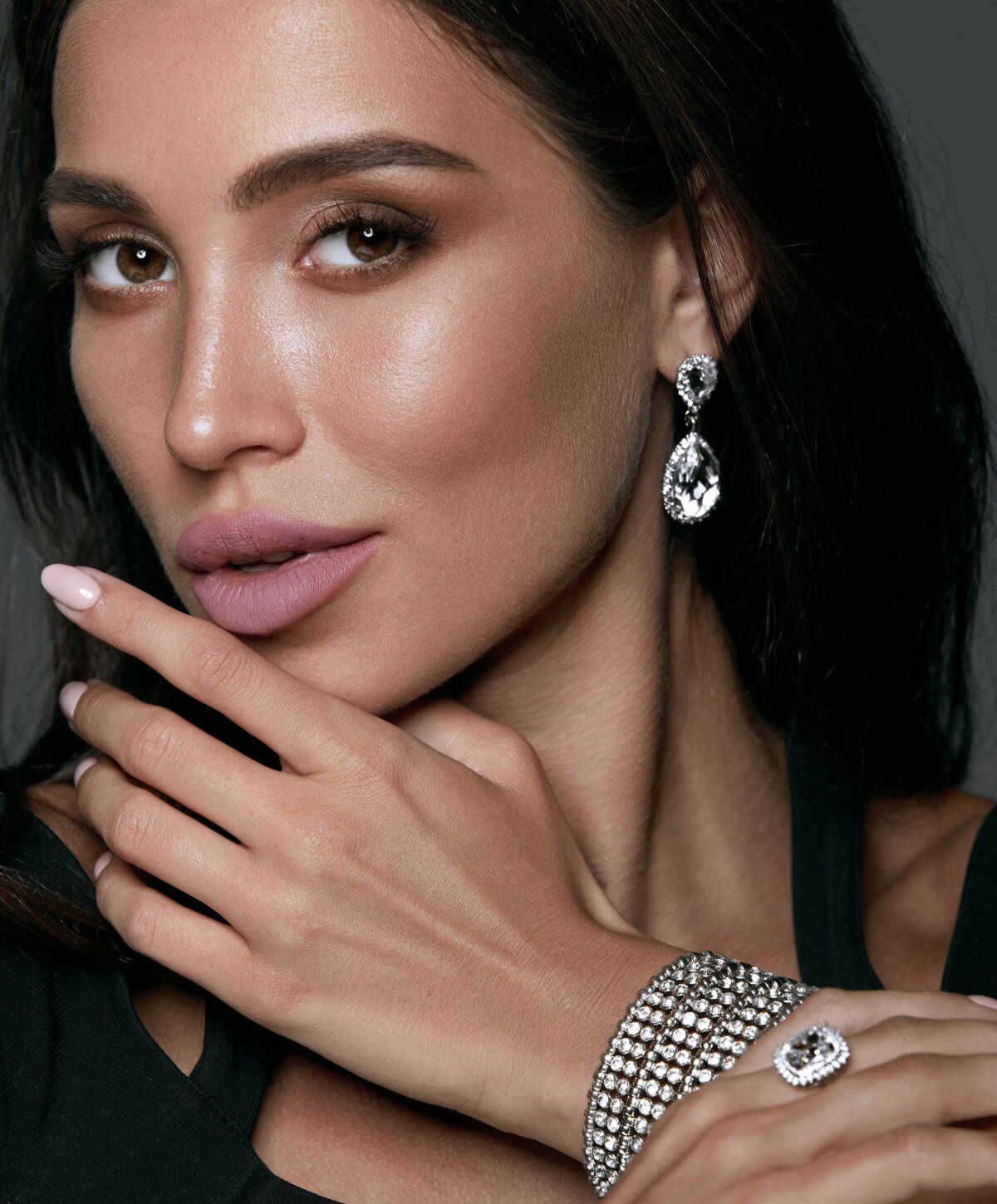 Close-up of woman wearing elegant jewelry.