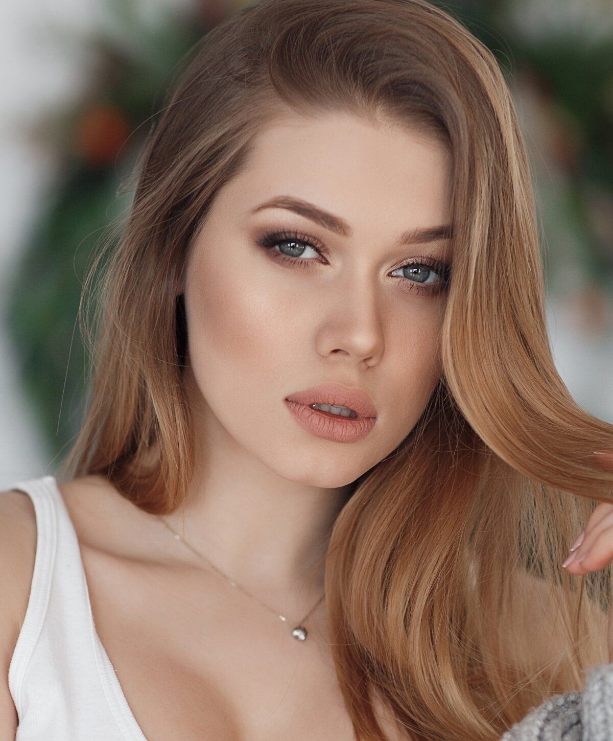 Portrait of a woman with long, wavy hair.