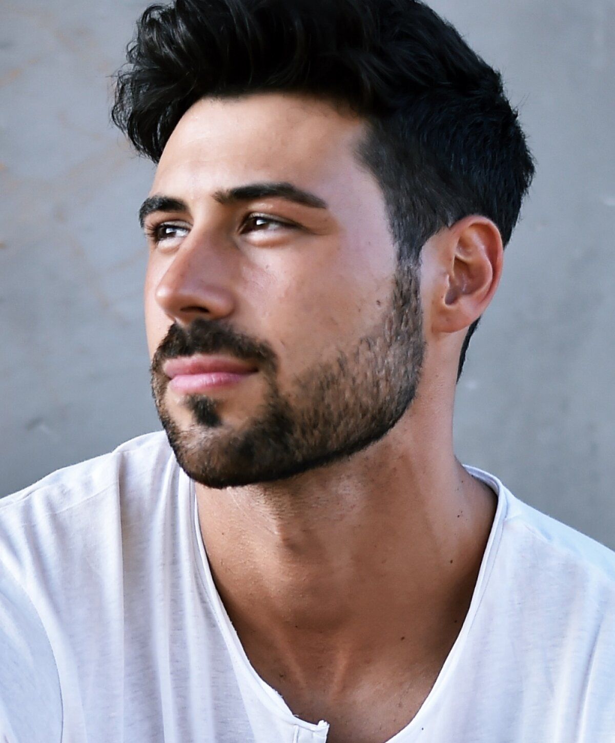 Young man with stylish hair and beard.