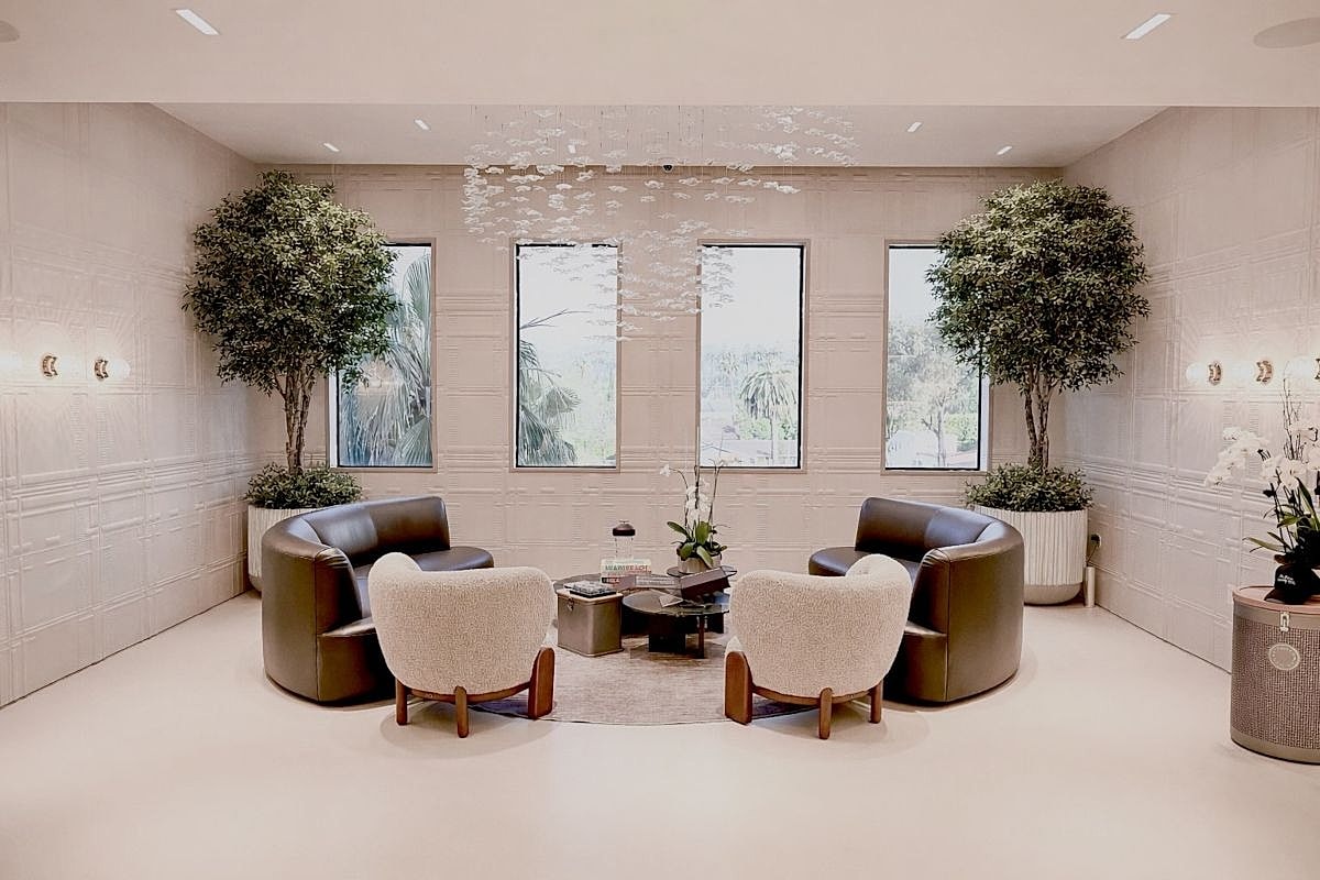 Stylish seating area with plants and natural light.