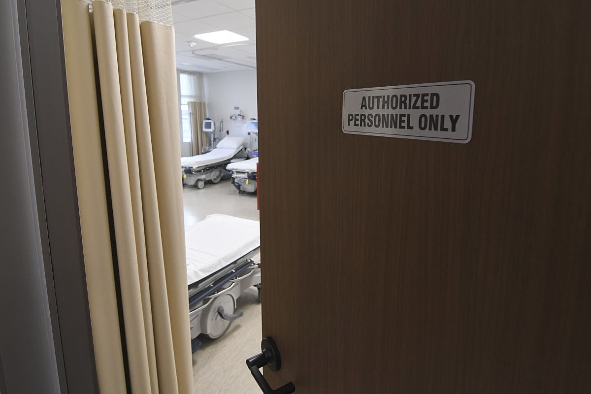 Hospital room door with authorization sign.