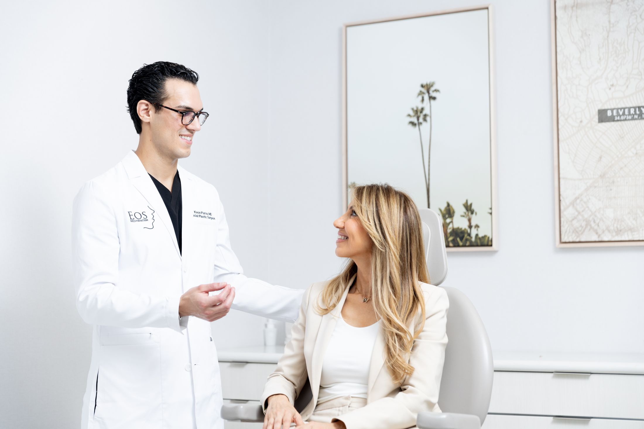 Dr. Keon Parsa, Beverly Hills Facial Plastic Surgeon consulting with a patient.