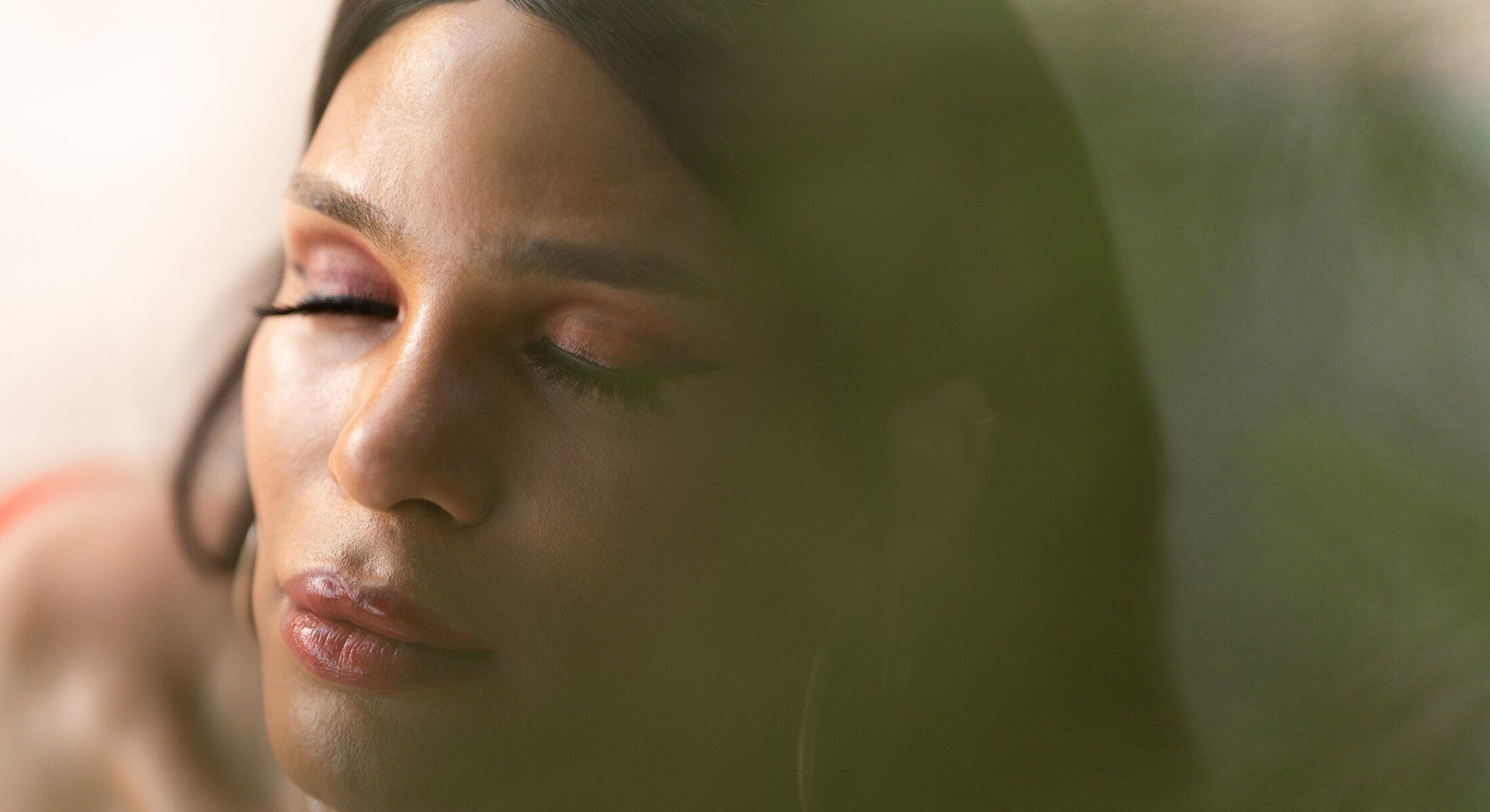 Close-up of a serene person with closed eyes.