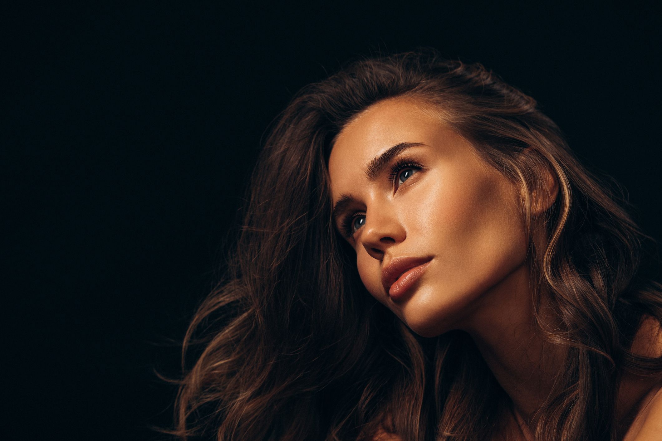 Portrait of a woman with flowing hair.