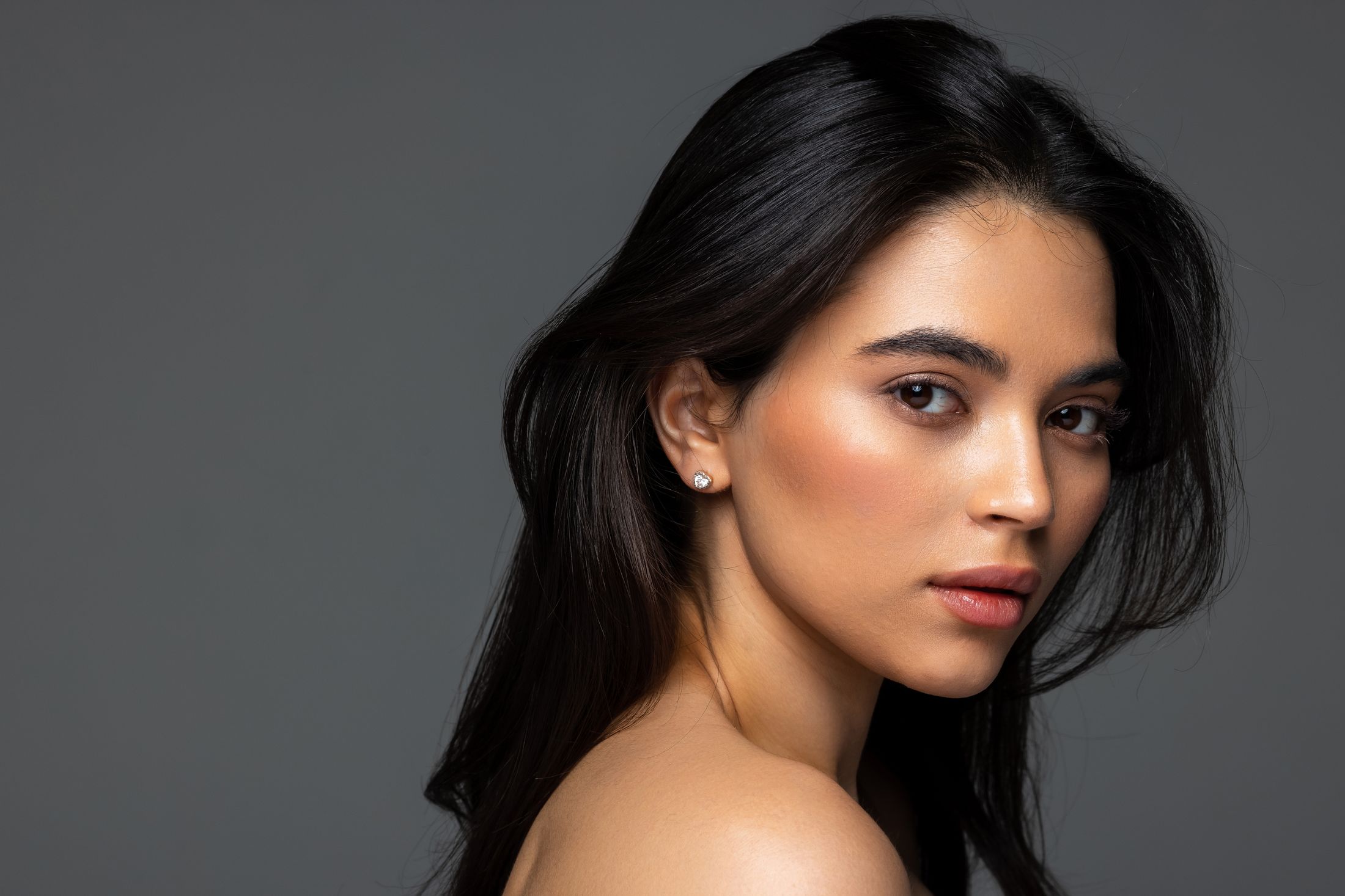 Portrait of a woman with long dark hair.